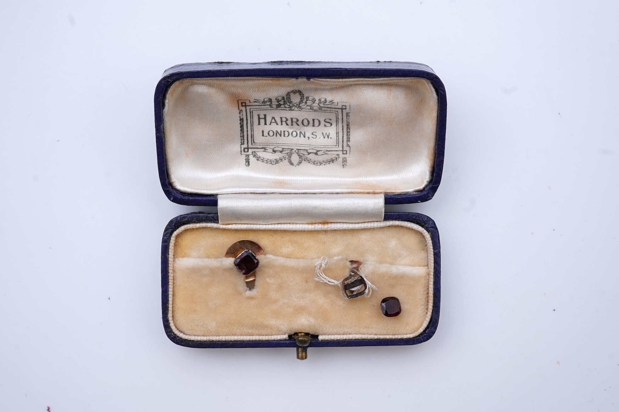 A collection of cufflinks and dress studs